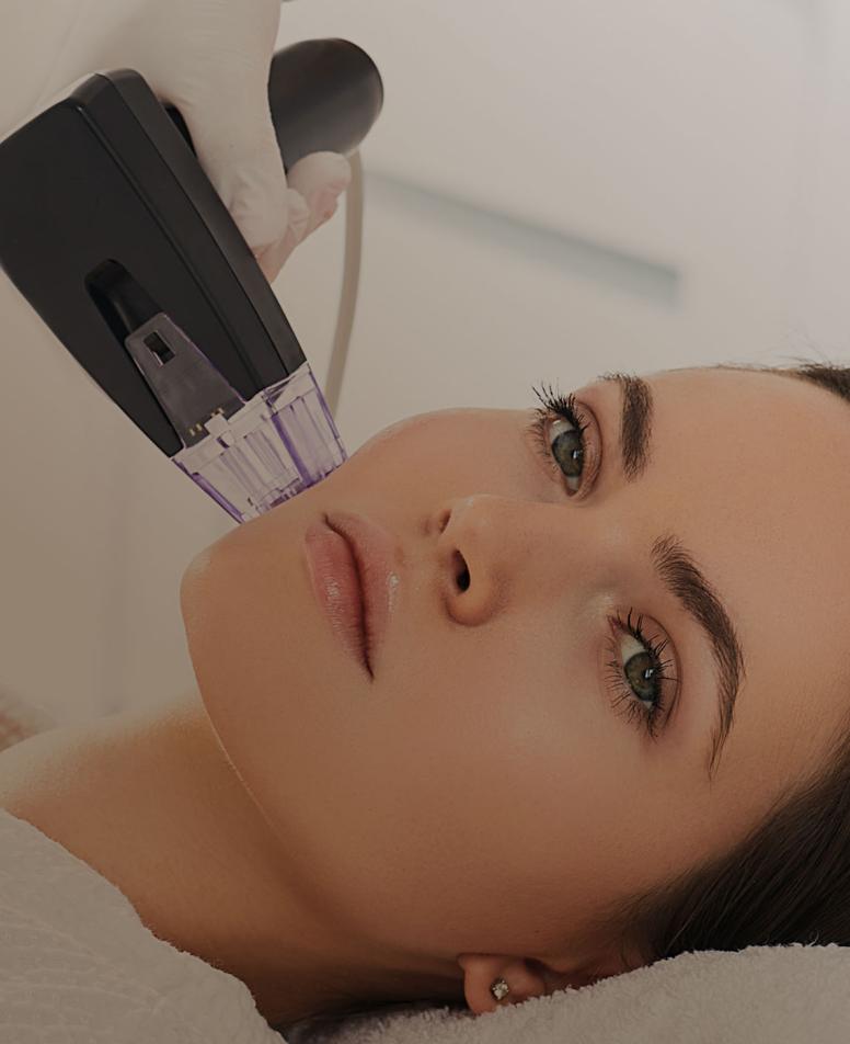 Woman receiving a face therapy treatment