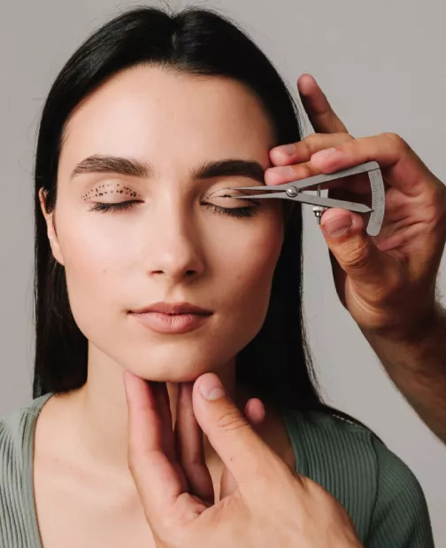 Portrait of a woman with surgical lines marked for blepharoplasty