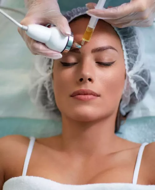 Close-up portrait of a woman lying down undergoing a facial treatment